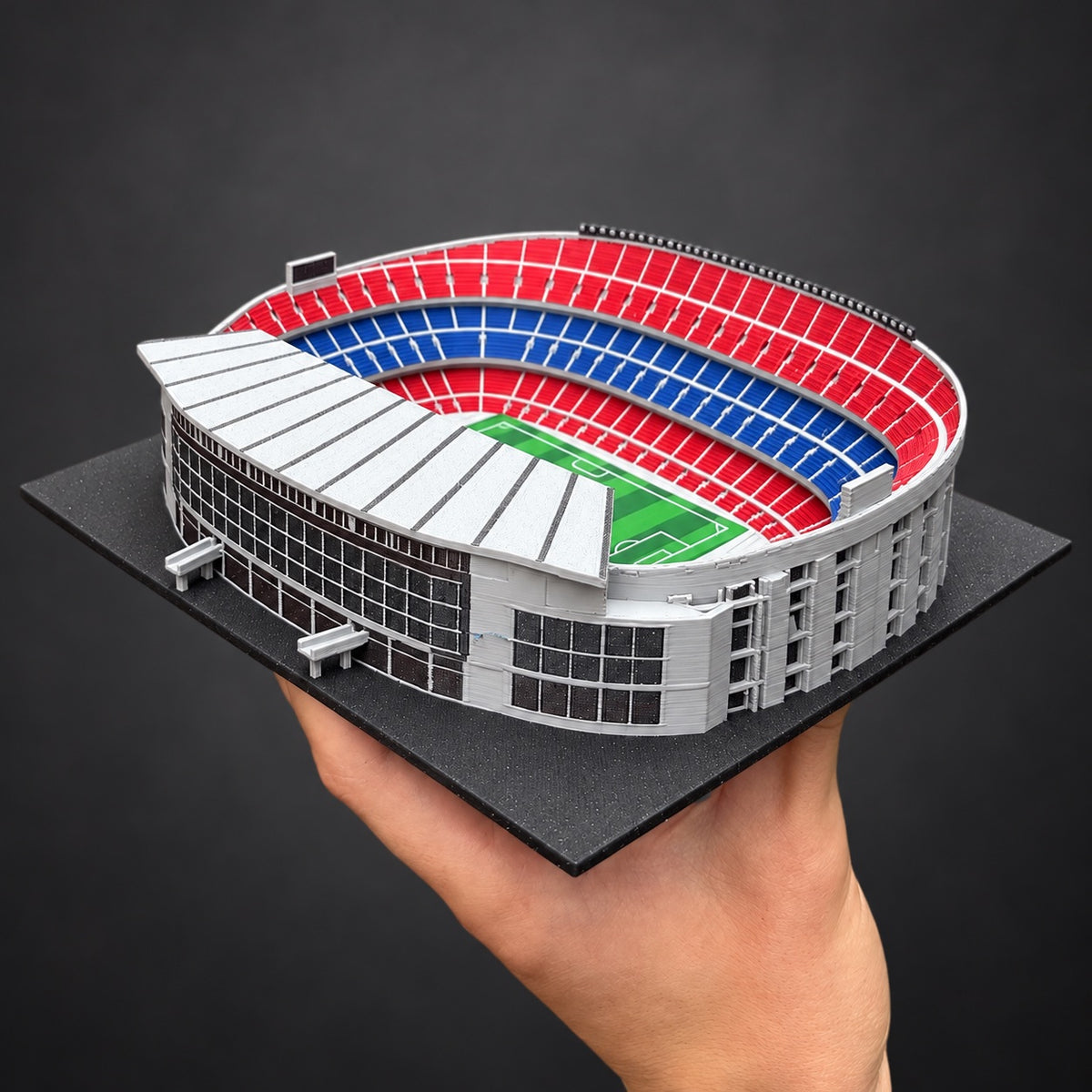 The actual colour Camp Nou model held in someone’s hands