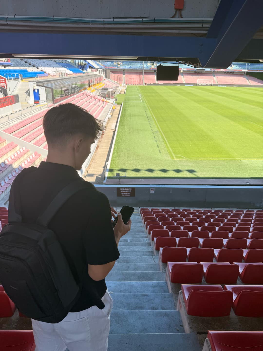 A StadiArt team member visiting the Letná stadium to collect visual references