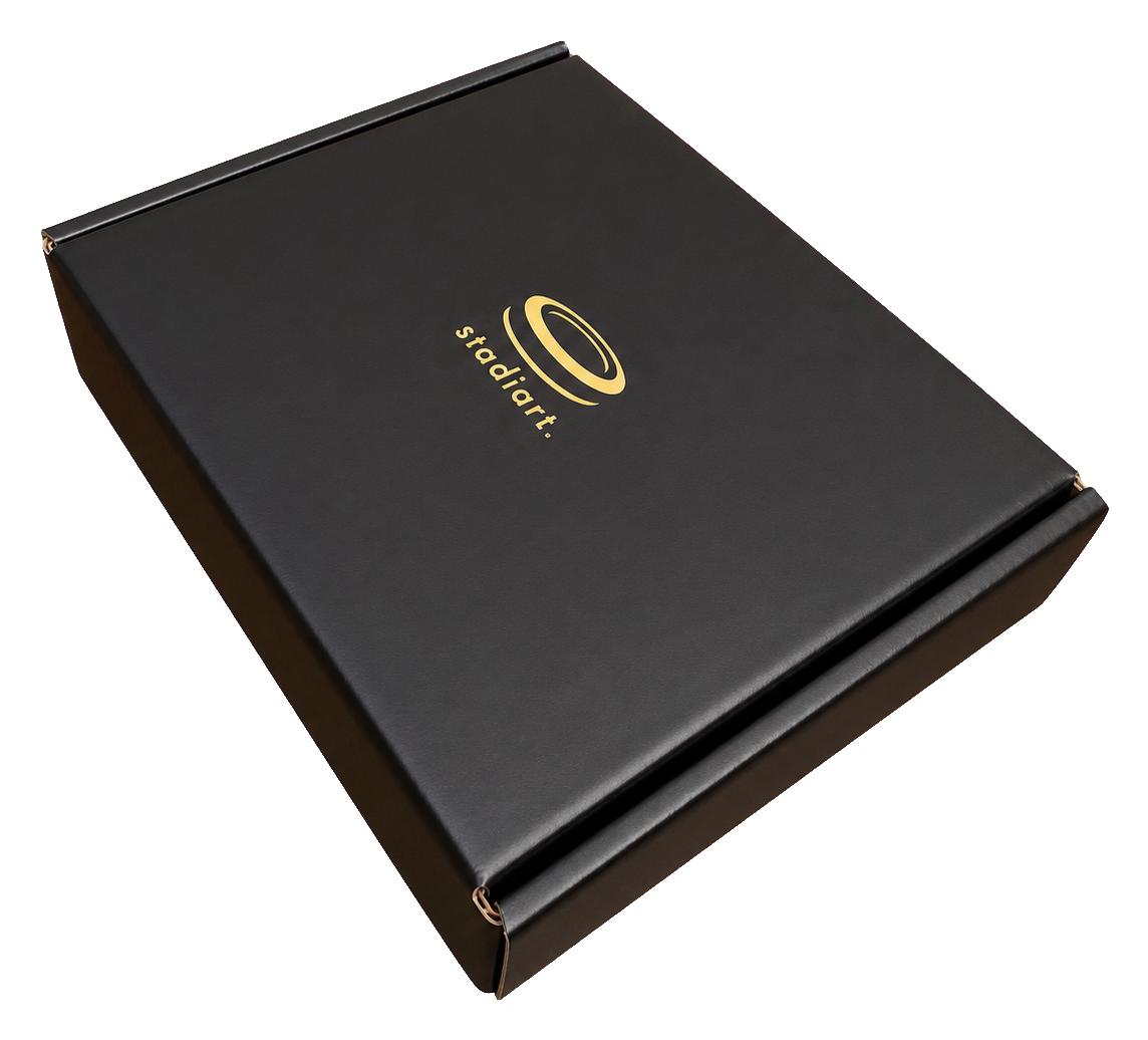 Matte-black StadiArt packaging with gold details